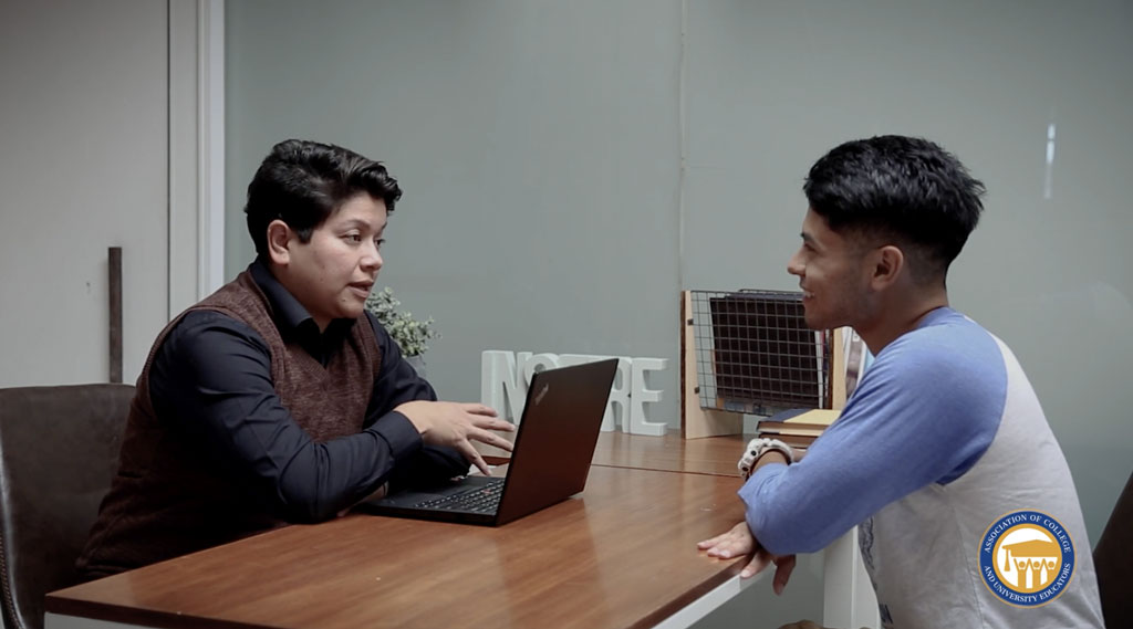 Instructor speaking with a student