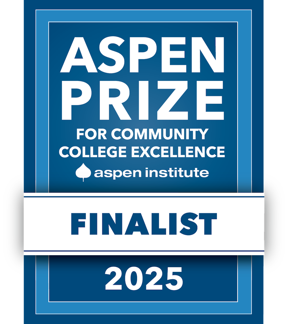 Sign that says "Aspen Prize Finalist for Community College Excellence 2025"