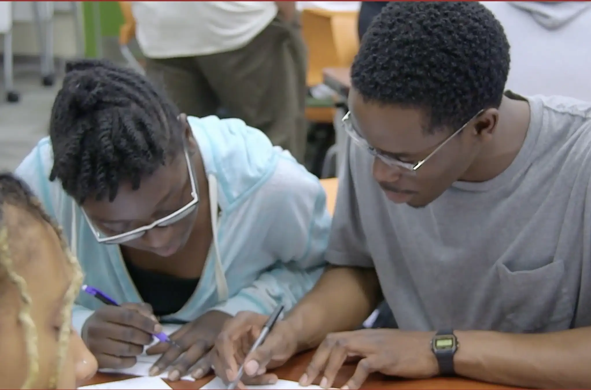 Screen Shot 2022-08-04 at 11.51.53 AM copy Higher education students working together in classroom