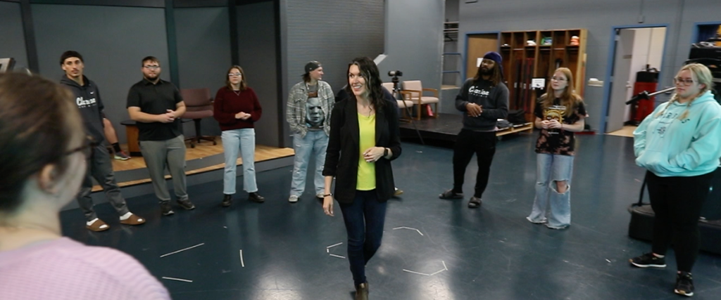 Faculty at PASSHE works with students in communications department