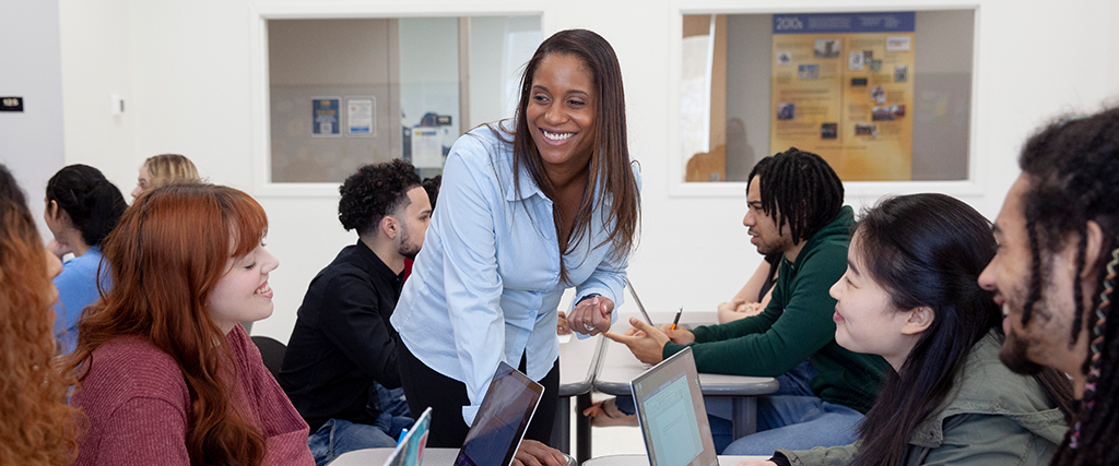 College professor teaching students in use of AI