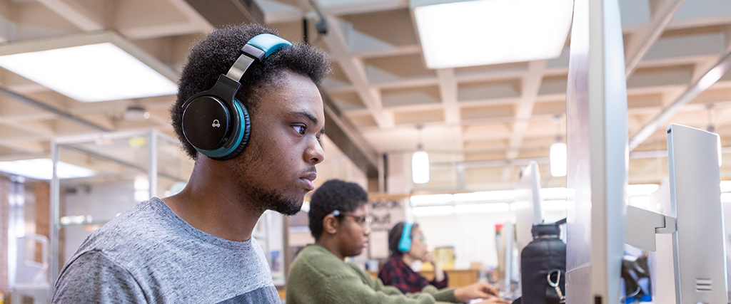 Student sits at computer