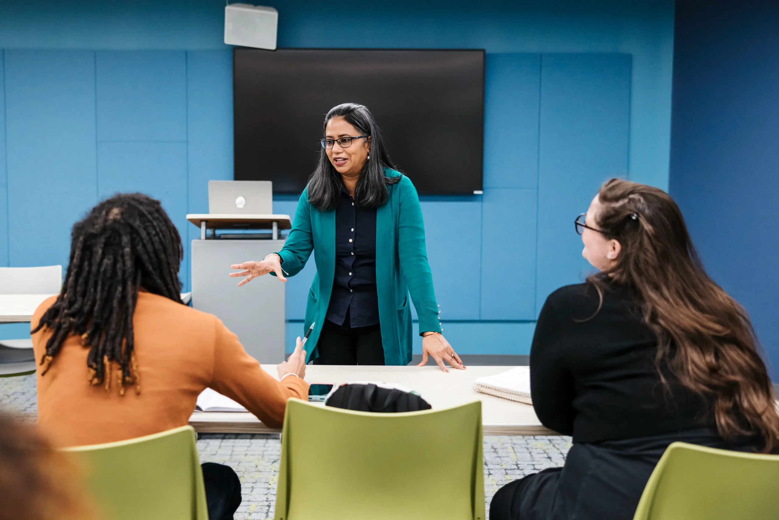 Faculty member leading a classroom discussion representing effective teaching across disciplines